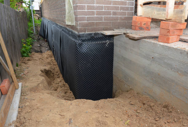SJ Waterproofing Pros technician performing targeted Emergency Waterproofing assessment in Howard, WI